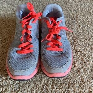 Pink and grey Nike tennis shoes